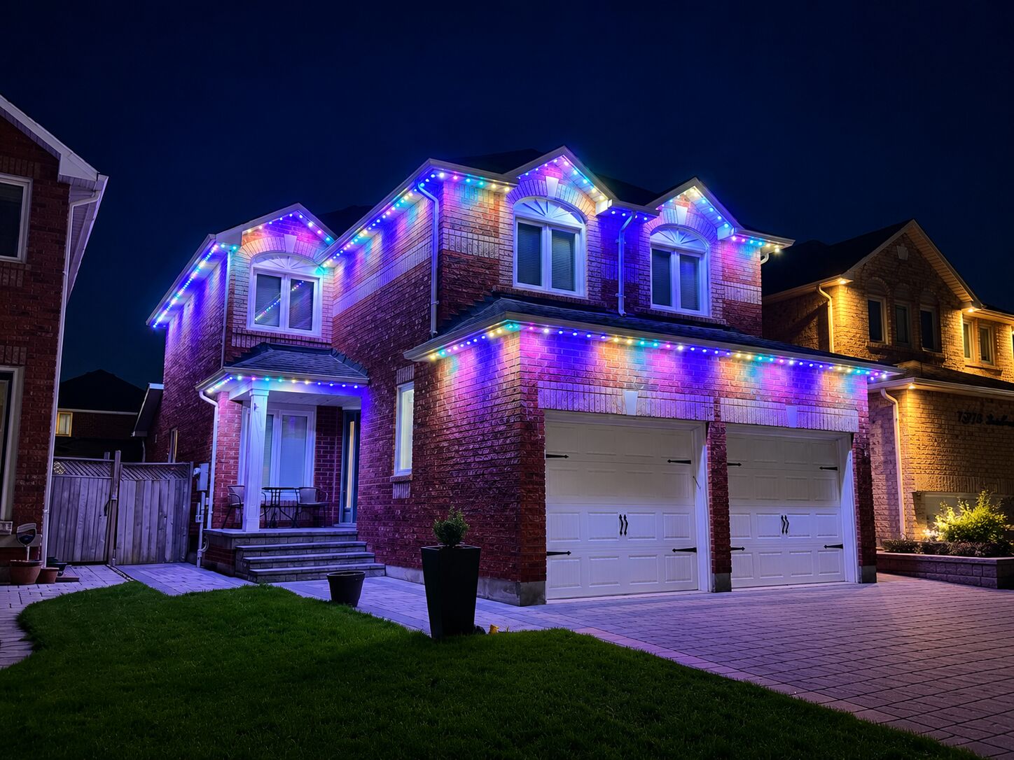 The same style of home lit in full colour at night