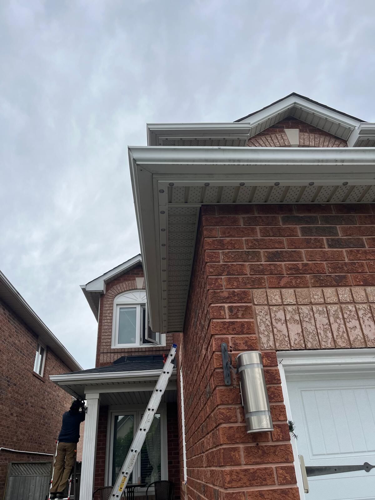 install day technician on ladder